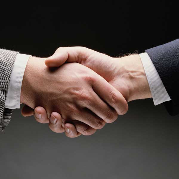 handshake between two men in business suits t20 1JaLOW