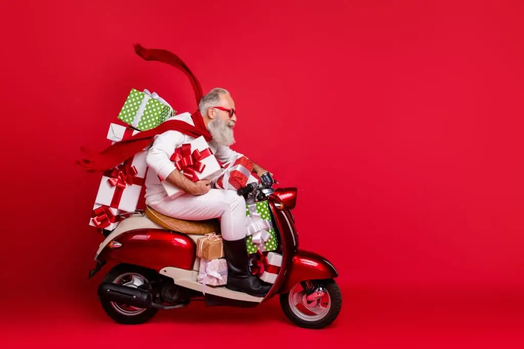 santa claus marketing baton rouge on a moped