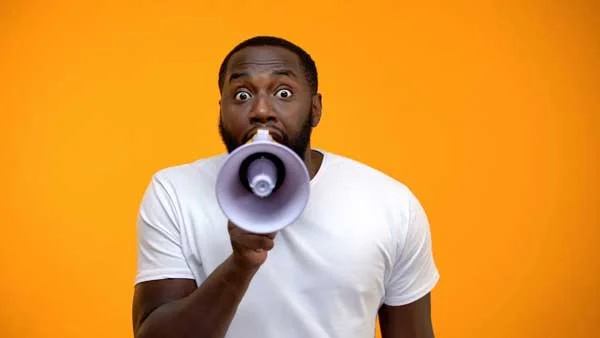 man yelling in megaphone best call to action example